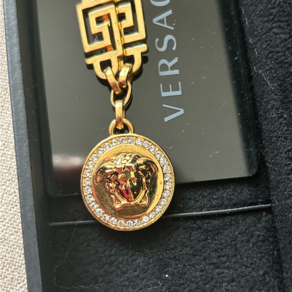 Authentic VERSACE Medusa  bracelet . Gold plated with stones